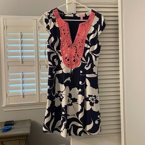 Small Lilly Pulitzer Dress in a dark navy blue pattern with salmon embroidery